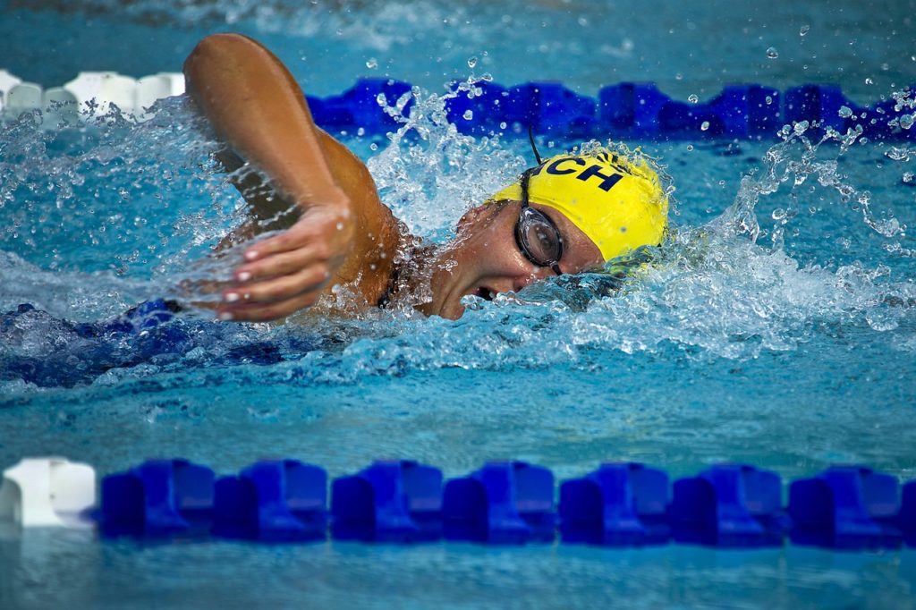 swimming in a crowded pool